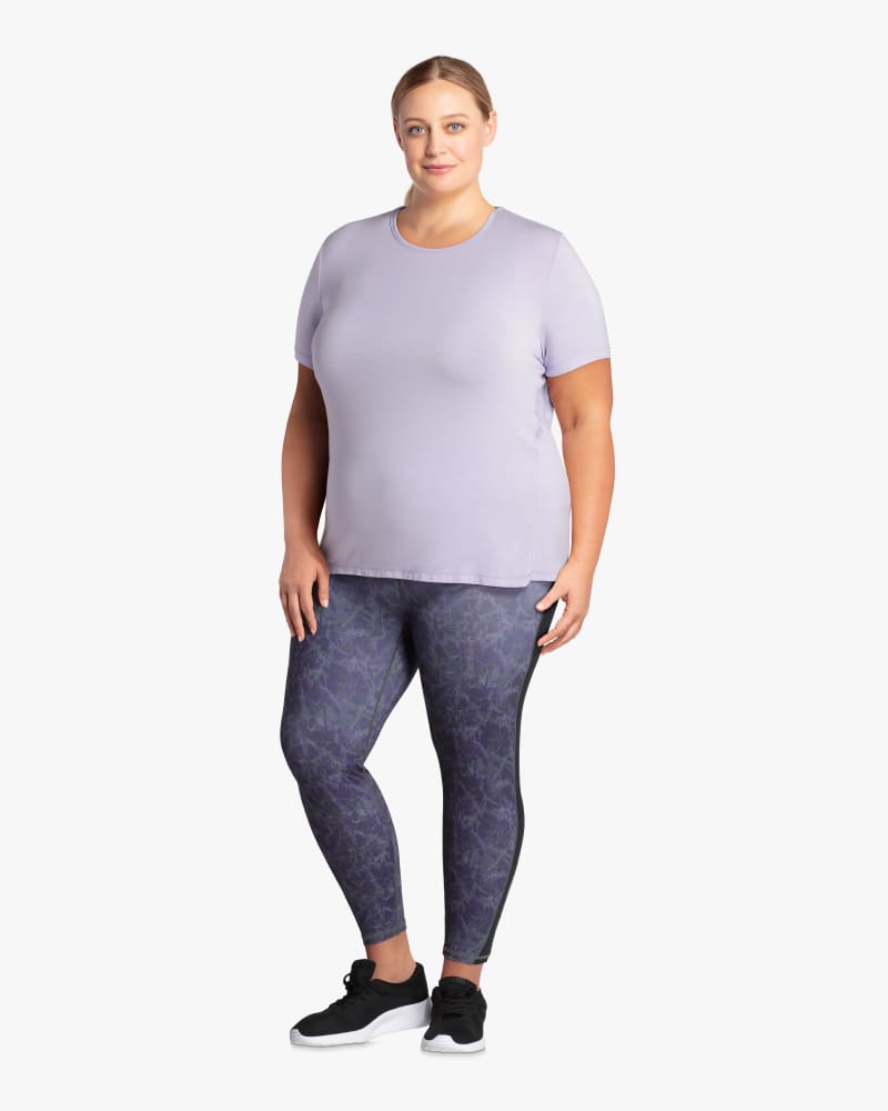 Plus size model with hourglass body shape wearing Dash Mesh Racerback Performance Tee  by Solspry | Dia&Co | dia_product_style_image_id:114675